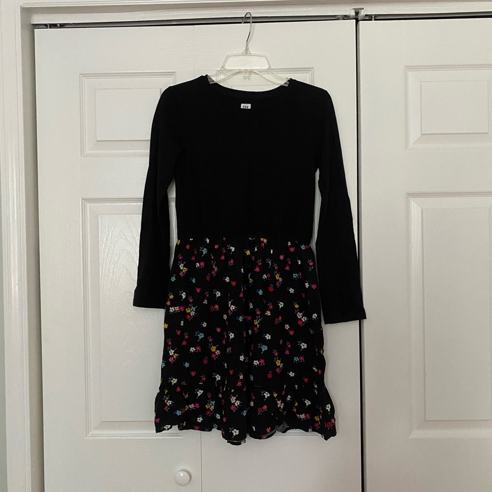 Girls black dress with flowers on the bottom.
